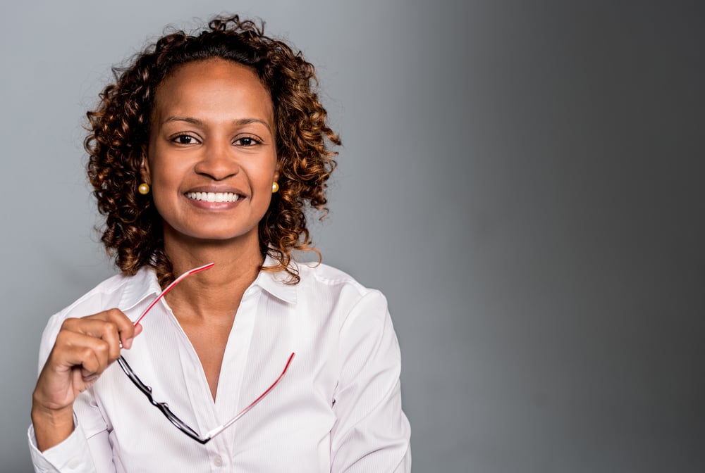 Smiling woman feeling relief after TMJ physical therapy in Atlanta