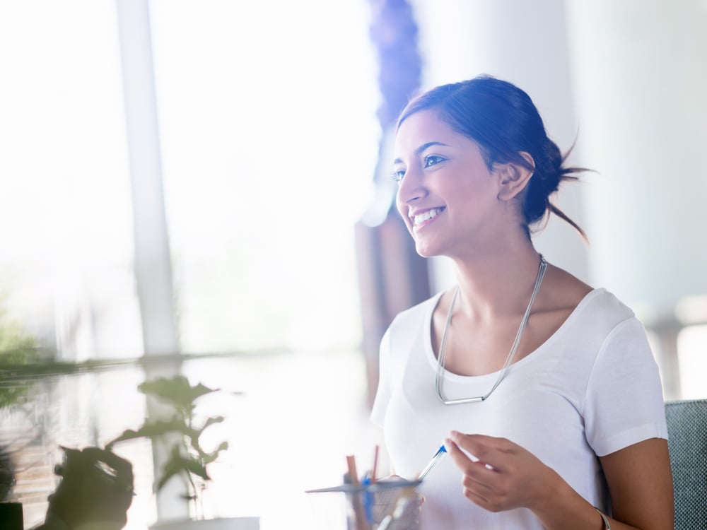 Young woman smiling post-TMJ physical therapy